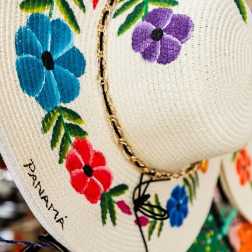 Panama hats embroidered with colorful flowers, traditional craftsmanship that reflects the local culture and art of Panama.
